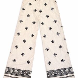 Embroidered White Wide-Leg Pants with Black Motif